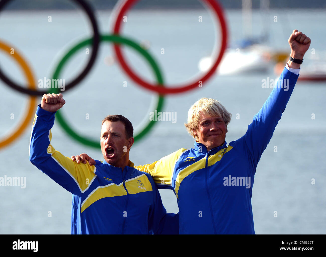Olympic Sailing, action during the London 2012 Olympic Games at the Weymouth & Portland Venue, Dorset, Britain, UK.  Fredrik Loof and Max Salminen of Sweden celebrate on the podium after winning the gold medal in the Star sailing class August 5th, 2012 Stock Photo