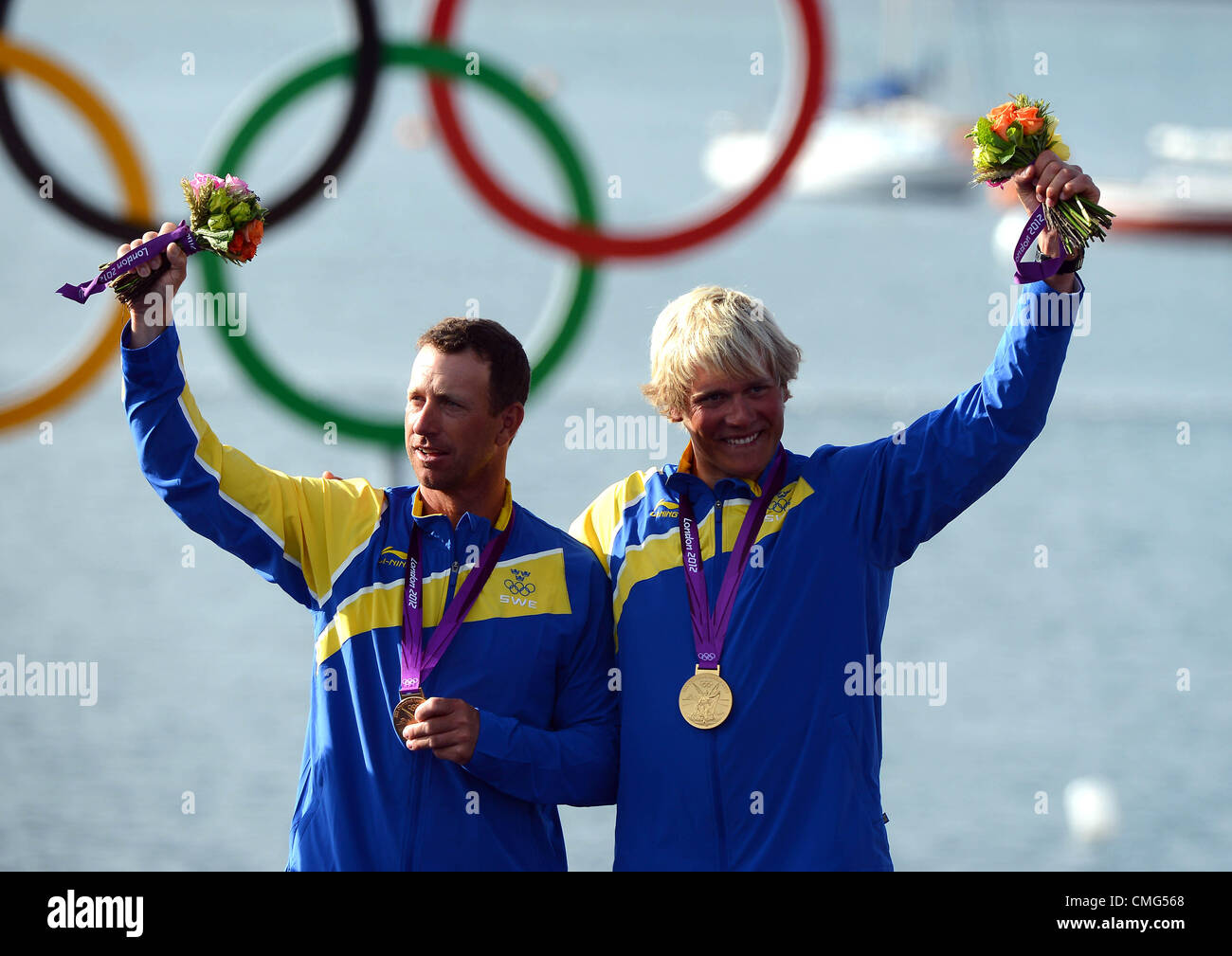 Olympic Sailing, action during the London 2012 Olympic Games at the Weymouth & Portland Venue, Dorset, Britain, UK.  Fredrik Loof and Max Salminen of Sweden celebrate on the podium after winning the gold medal in the Star sailing class August 5th, 2012 Stock Photo