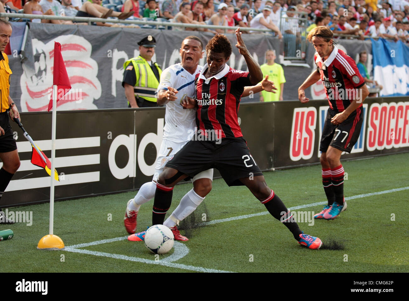 04.08.2012. Massachusetts , USA.  AC Milan's Kevin Constant (21) holds back CD Olimpia's Carlos Will Mejia (7) from the ball. AC Milan lead 3-0 at the half.  AC Milan played CD Olimpia at Gillette Stadium in Foxborough, Massachusetts  on August 4, 2012. Stock Photo