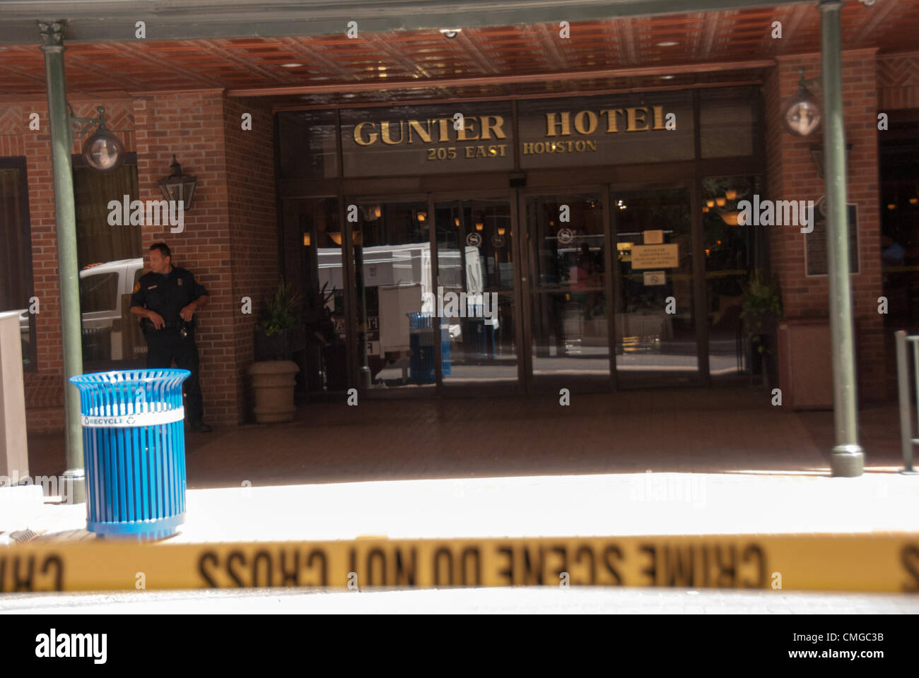 6 August 2012 San Antonio, Texas, USA - San Antonio police officers guard the front of  the Gunter Hotel in San Antonio, Texas. A bomb threat had been called in at 11:00 a.m., guests were evacuated immediately and the surrounding streets were blocked. Stock Photo