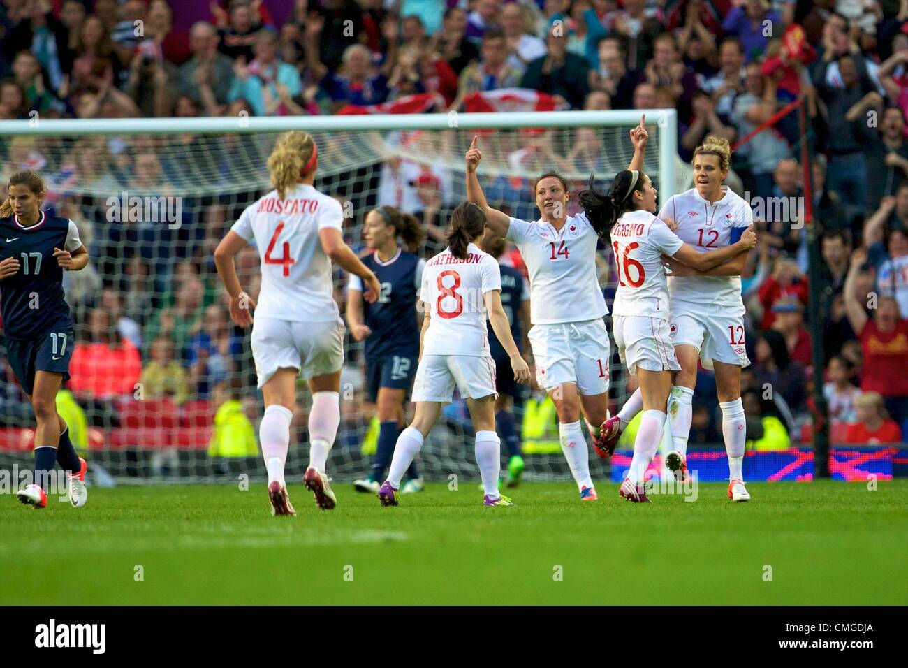 06.08.2012 Manchester, England. Canada celebrate going a goal ahead during the women's semi final match between Team USA and Canada at Old Trafford. USA scored a late injury time winner to go through to the gold medal match by a score of 4-3. Stock Photo