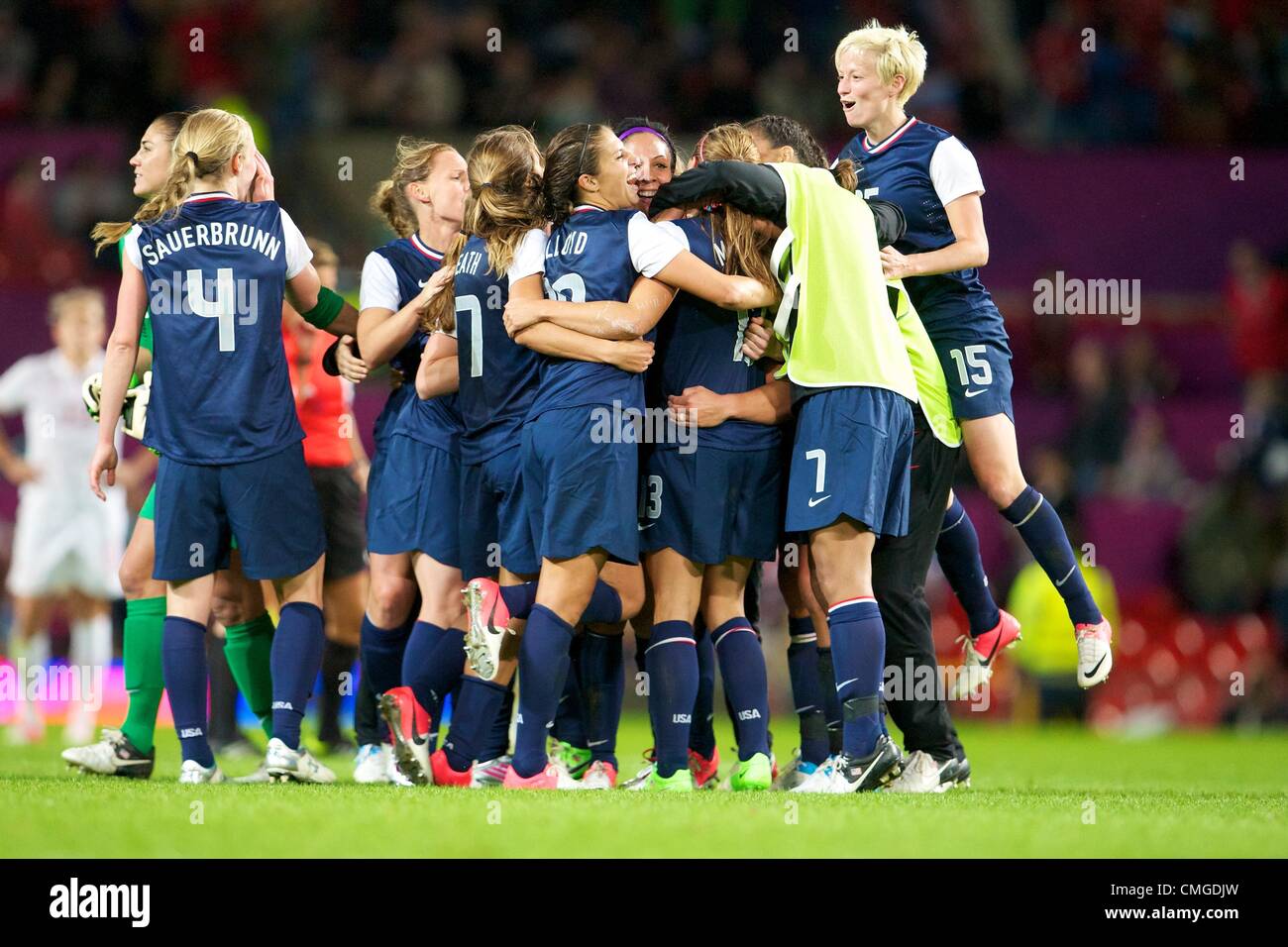 06.08.2012 Manchester, England. Team USA celebrate a last minute victory  in the women's semi final match between Team USA and Canada at Old Trafford. USA scored a late injury time winner to go through to the gold medal match by a score of 4-3. Stock Photo