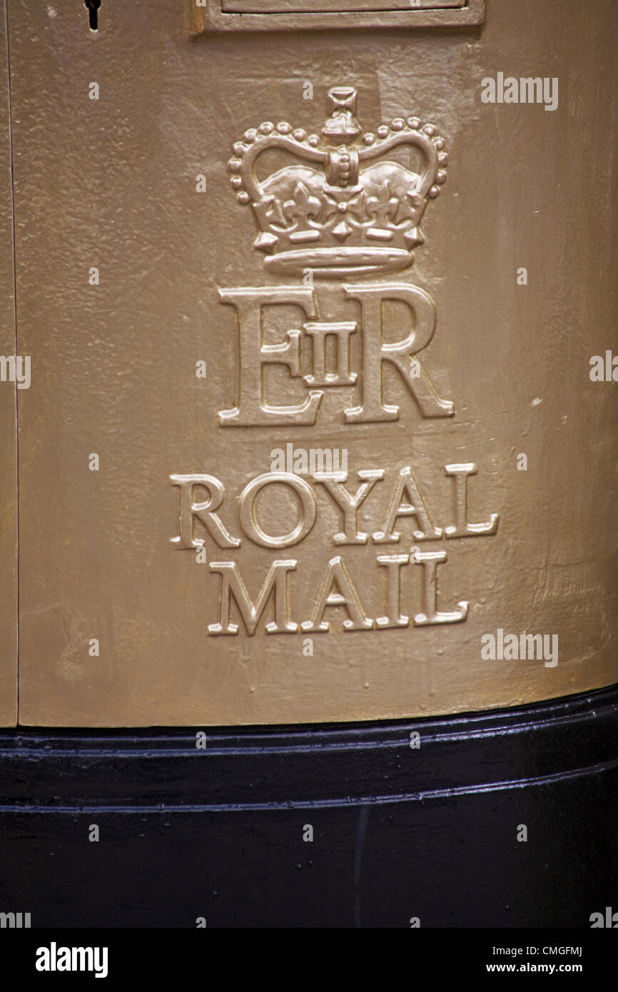 UK Monday 6 August 2012. Royal mail gold painted post box at Sherborne