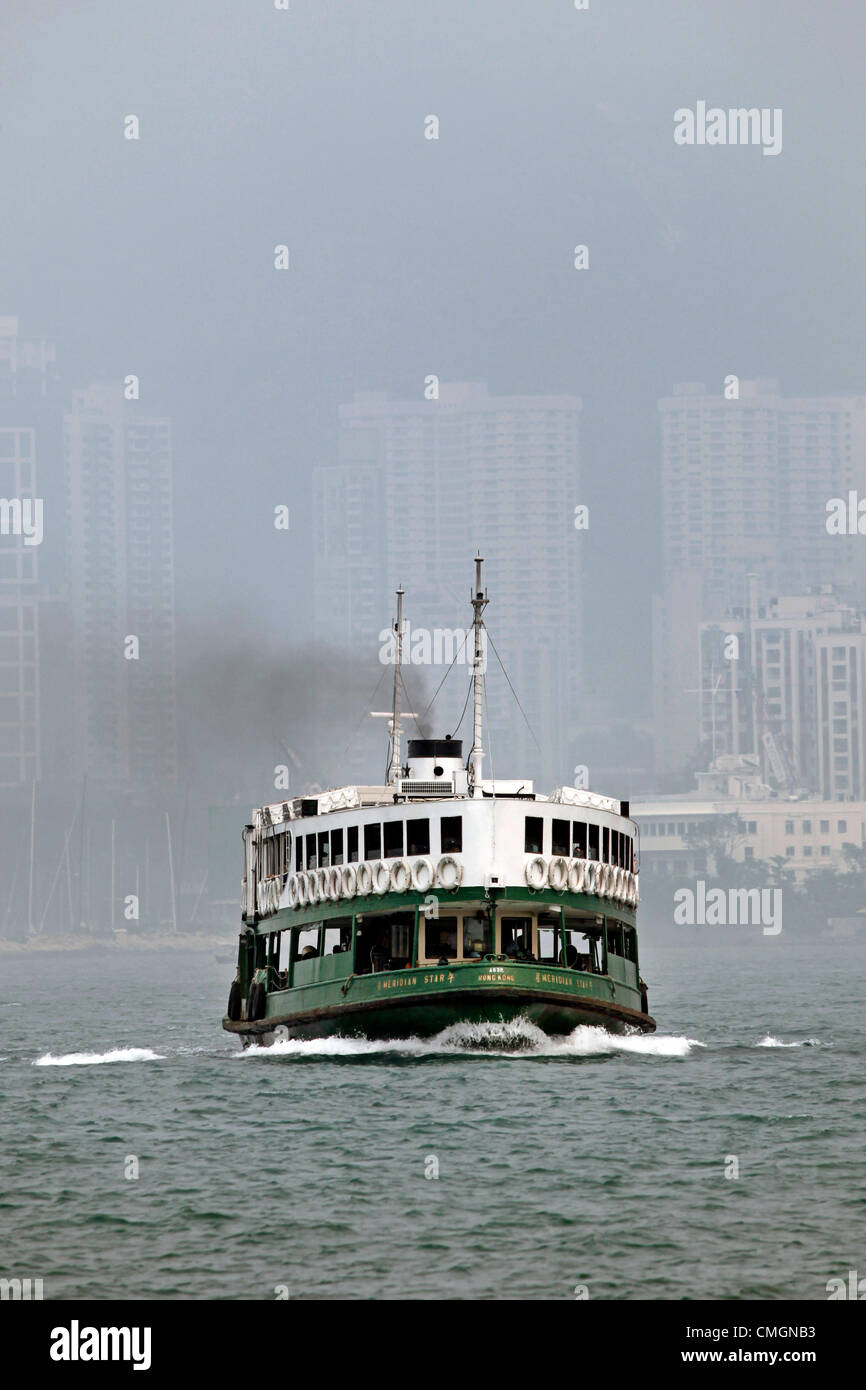 Hong Kong, China. 7th August 2012. The worst smog and air pollution in two years has hit Hong Kong, China. Views across Victoria Harbour and to and from the Peak were obscured amidst warnings for the young and elderly to stay indoors. Coal fired power stations and traffic are a major cause of the environmental problems but also the output of factories in neighbouring China. Stock Photo