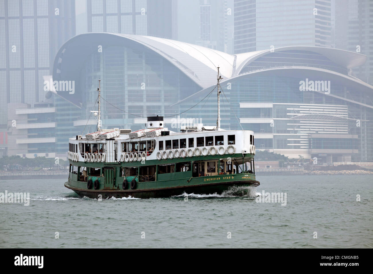 Hong Kong, China. 7th August 2012. The worst smog and air pollution in two years has hit Hong Kong, China. Views across Victoria Harbour and to and from the Peak were obscured amidst warnings for the young and elderly to stay indoors.Coal fired power stations and traffic are a major cause of the environmental problems but also the output of factories in neighboring China. Stock Photo