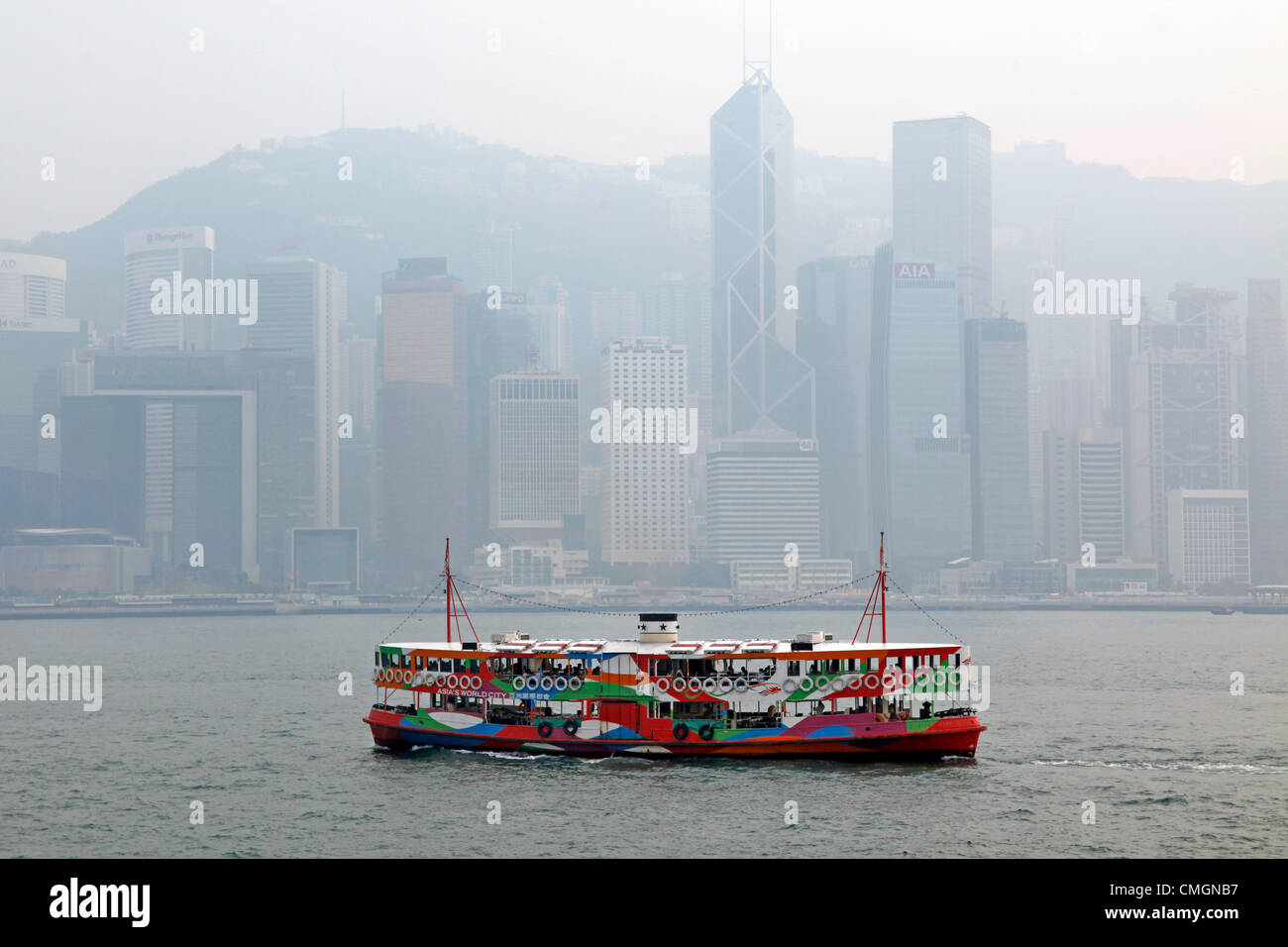 Hong Kong, China. 7th August 2012. The worst smog and air pollution in two years has hit Hong Kong, China. Views across Victoria Harbour and to and from the Peak were obscured amidst warnings for the young and elderly to stay indoors.Coal fired power stations and traffic are a major cause of the environmental problems but also the output of factories in neighboring China. Stock Photo