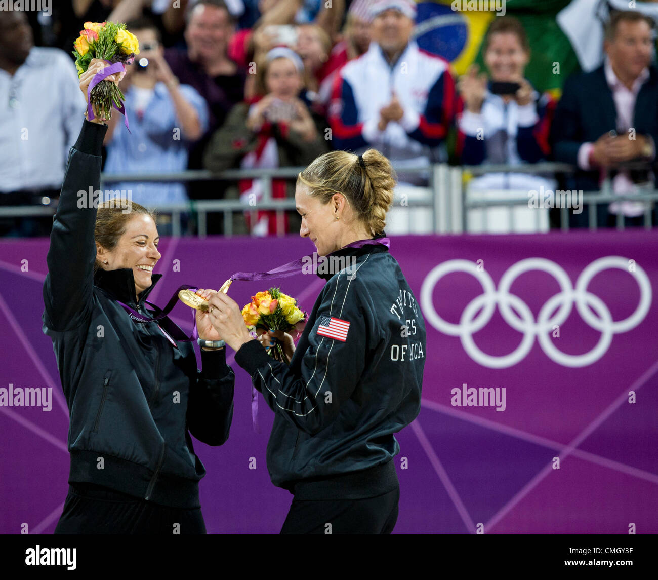 Aug. 8, 2012 - London, England, United Kingdom - Gold medallists Misty May-Treanor and Kerri Walsh-Jennings (USA),  looks at their medals on the awards stand after winning their 3rd gold medal in Beach Volleyball game in the London Olympics 2012 at the Horse Guards Parade on August 08, 2012 in London, United Kingdom. (Credit Image: © Paul Kitagaki Jr./ZUMAPRESS.com) Stock Photo