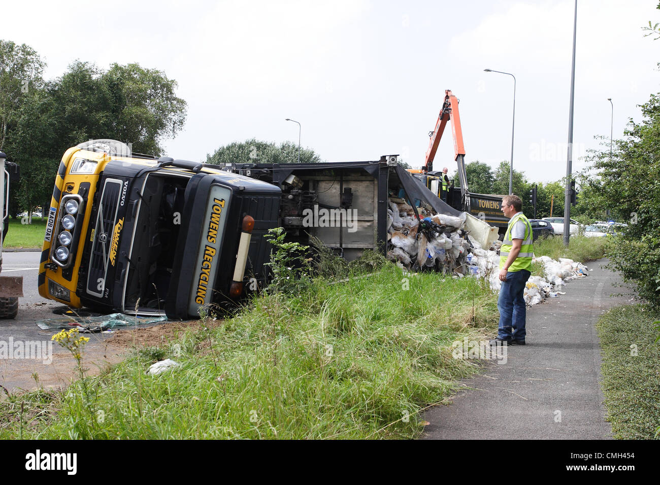 9th Aug 2012. A heavy truck owned by the Weston super Mare based Towens Recycling turned over while travelling on A4174 round the Wick roundabout near the Willy Wicket pub. It was carrying waste for recycling. Credit:  Timothy Large / Alamy Live News Stock Photo