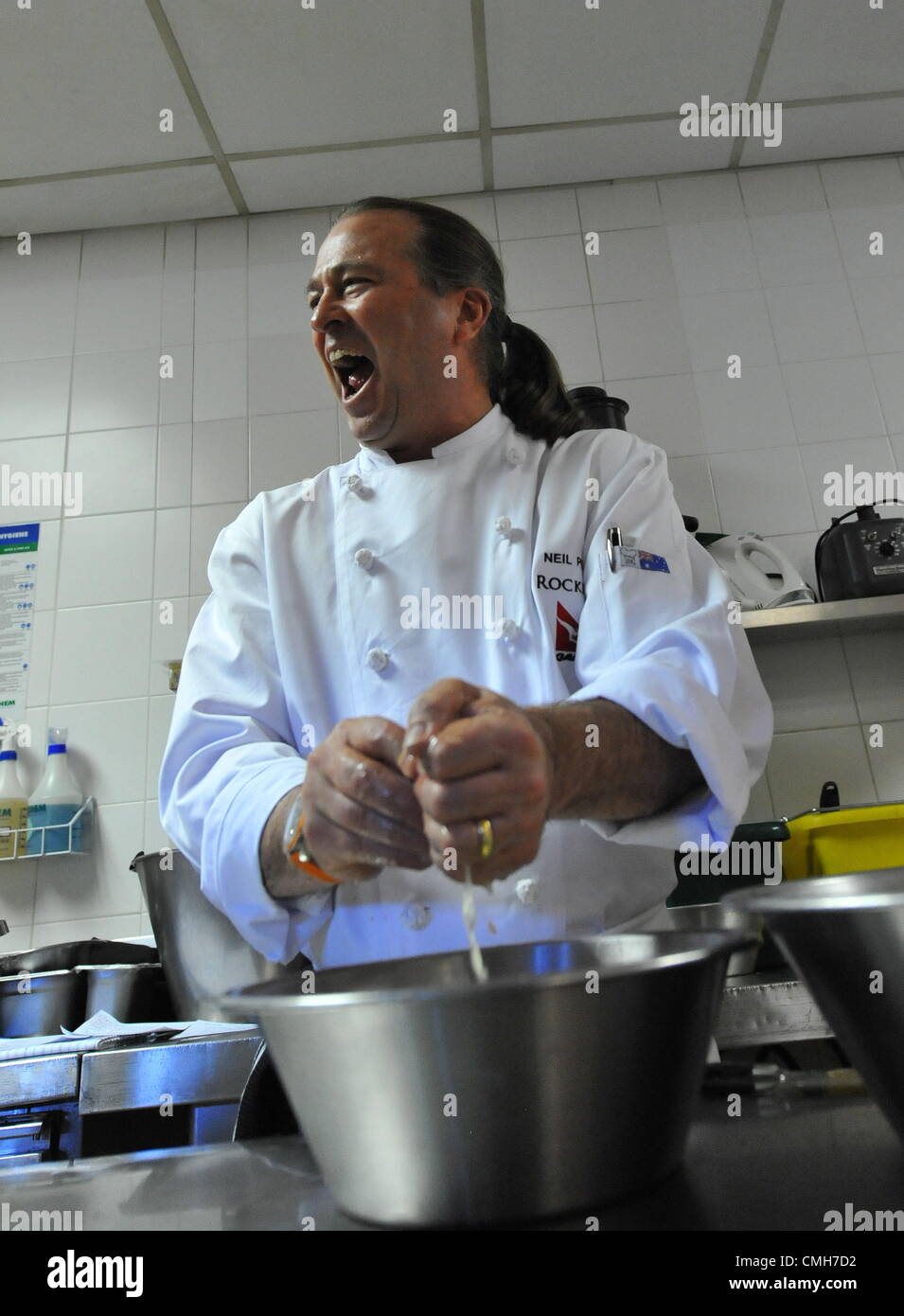 JOHANNESBURG, SOUTH AFRICA: Top Australian chef Neil Perry on August 6, 2012 in the kitchen of the Level Four Restaurant of the 54 on Bath hotel in Johannesburg, South Africa. Perry got a better understanding of South African cooking styles during a cooking demonstration filmed for Australian television. (Photo by Gallo Images / Duif du Toit) Stock Photo