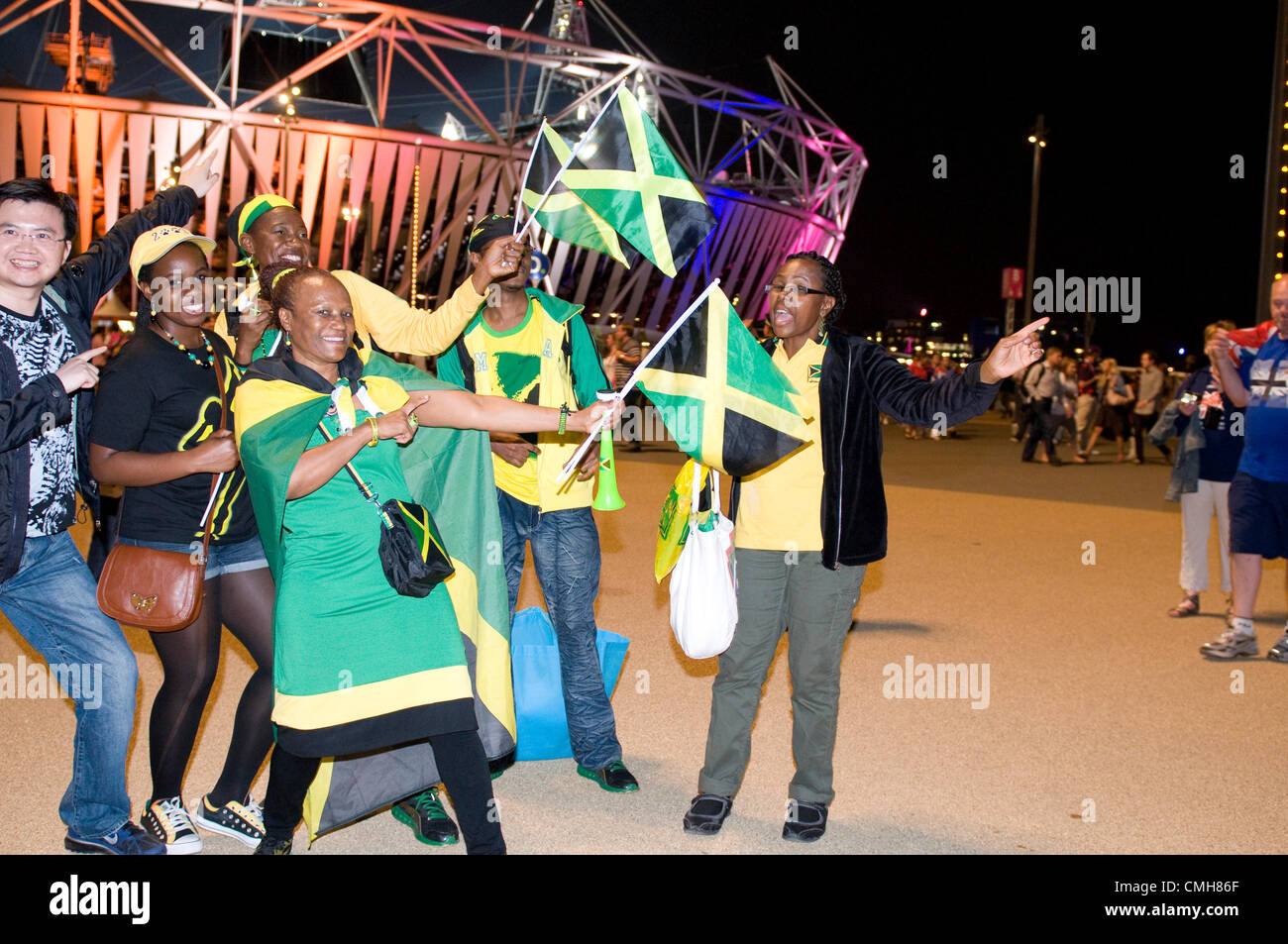 Usain Bolt and Jamaican fans celebrate his victory in the 200 metres men's sprint final outside the Athletics Stadium in the Olympic Park, 9 August 2012. Stock Photo