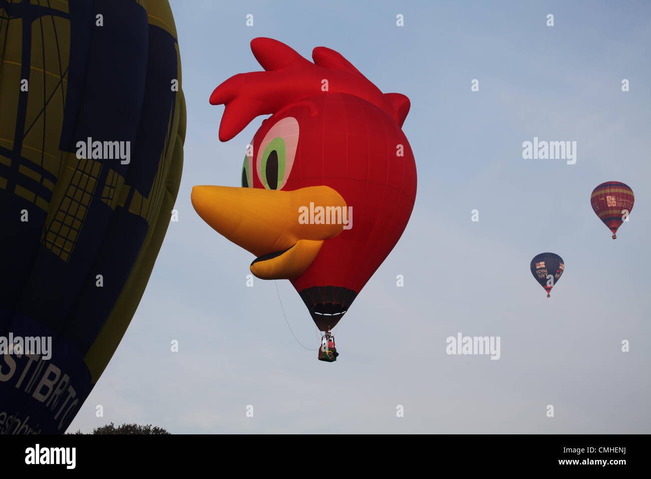 11th August 2012, 34th Bristol International Balloon Fiesta, Bristol, UK.  A Woody Woodpecker hot air balloon, from Brazil, takes flight along with other participants. Stock Photo