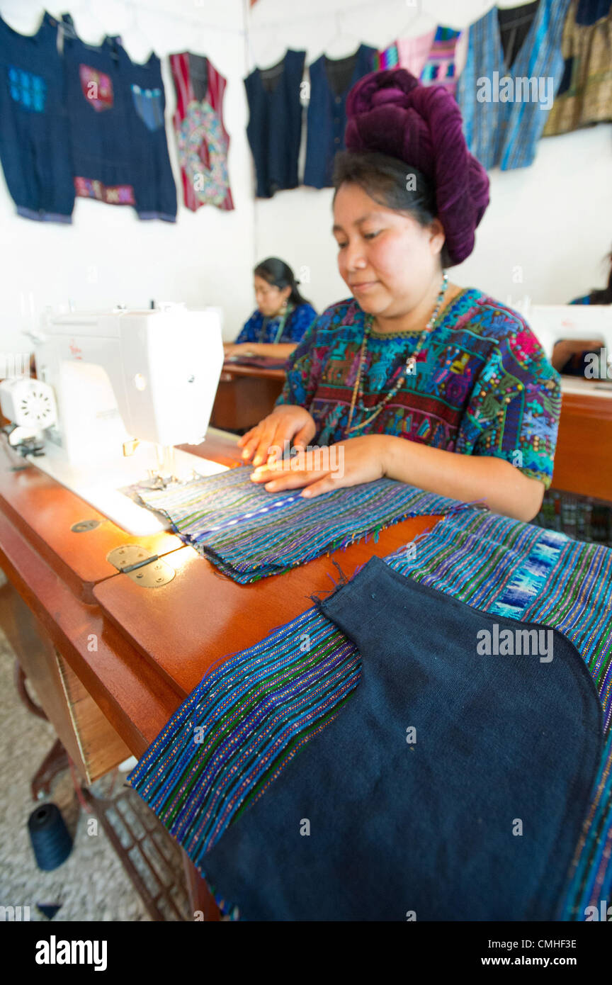 Aug. 2, 2012 - Santa Catarina Polopo (Municipal, Solola (Department, Guatemala - August 2, 2012, Solola, Guatemala - A Counterpart International beneficiary works at a sewing machine in a class supported by Counterpart through partner agency Grupos Gestores (Management Groups) in the town of Santa Catarina Palopo, Guatemala. Through the four-month long course, 25 local women are learning sewing skills they can use to make items for sale in this tourist town. (Credit Image: © David Snyder/ZUMAPRESS.com) Stock Photo