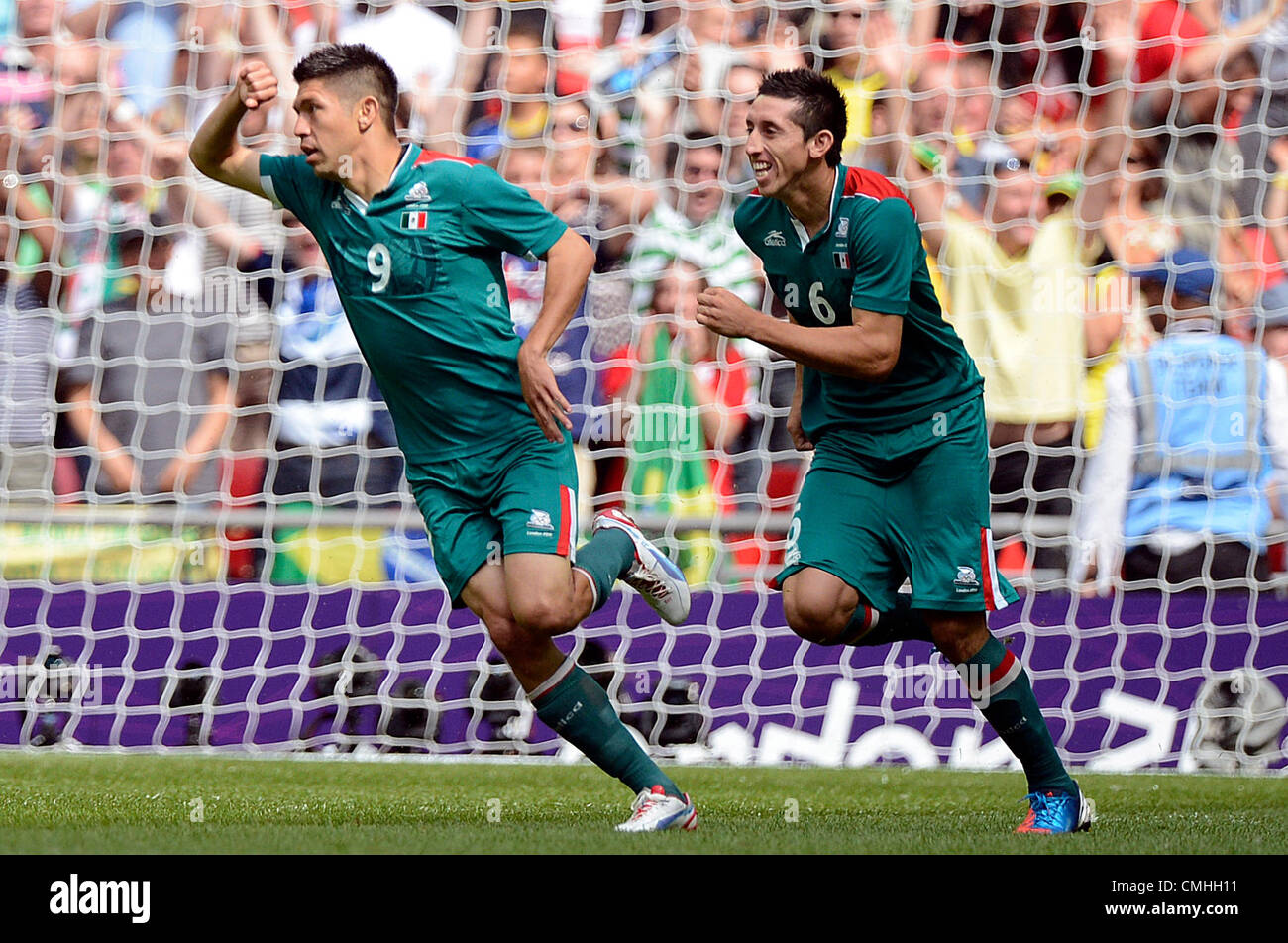 11th Aug 2012. 11.08.2012. Wembley Stadium, London, England.  Oribe Peralta (L) of Mexico celebrates with his team mates Hector Herrera after scoring the goal for 1-0 during the Men's Soccer Gold Medal Match between Brazil and Mexico for the London 2012 Olympic Games Soccer tournament at Wembley Stadium in London, Great Britain, 11 August 2012. Credit:  Action Plus Sports Images / Alamy Live News Stock Photo