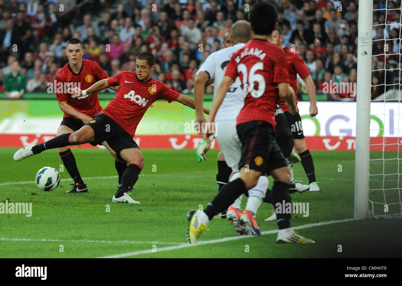 11.08.2012. Hanover, Germany.  Manchester's Javier Hernandez (Chicharito, 2-l) shoots the ball during the friendly soccer match between Hanover 96 and Manchester United at the AWD Arena stadium in Hanover, Germany, 11 August 2012. Stock Photo
