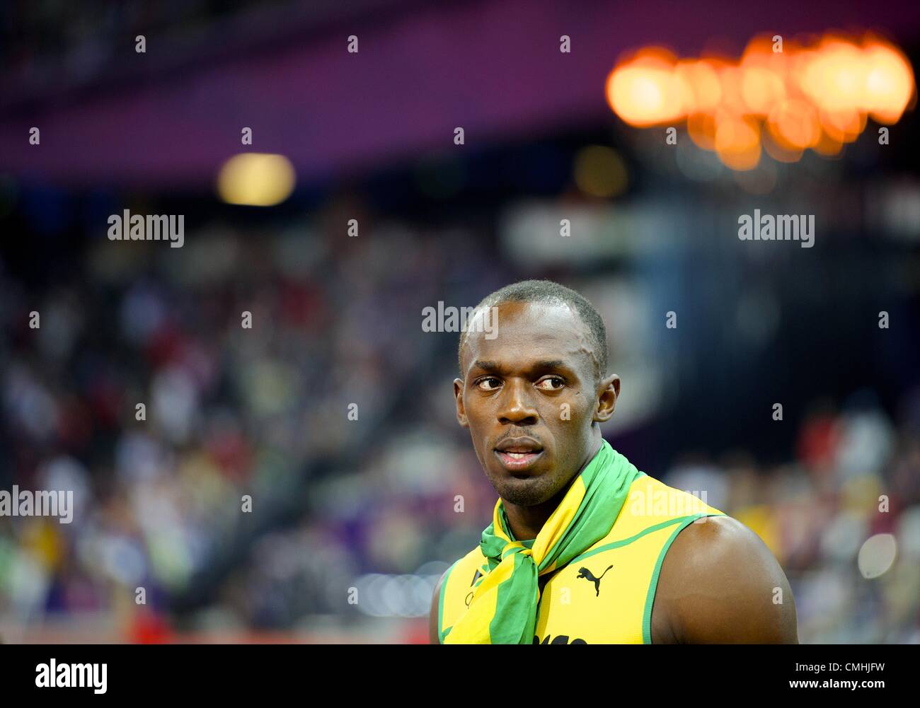 Aug. 11, 2012 - London, England, United Kingdom - USAIN BOLT stares towards the gathering media as the Jamaican 4x100m relay team is interviewed by the media after winning gold and setting a new world record of 36.84 seconds during the 2012 London Summer Olympics. (Credit Image: © Mark Makela/ZUMAPRESS.com) Stock Photo
