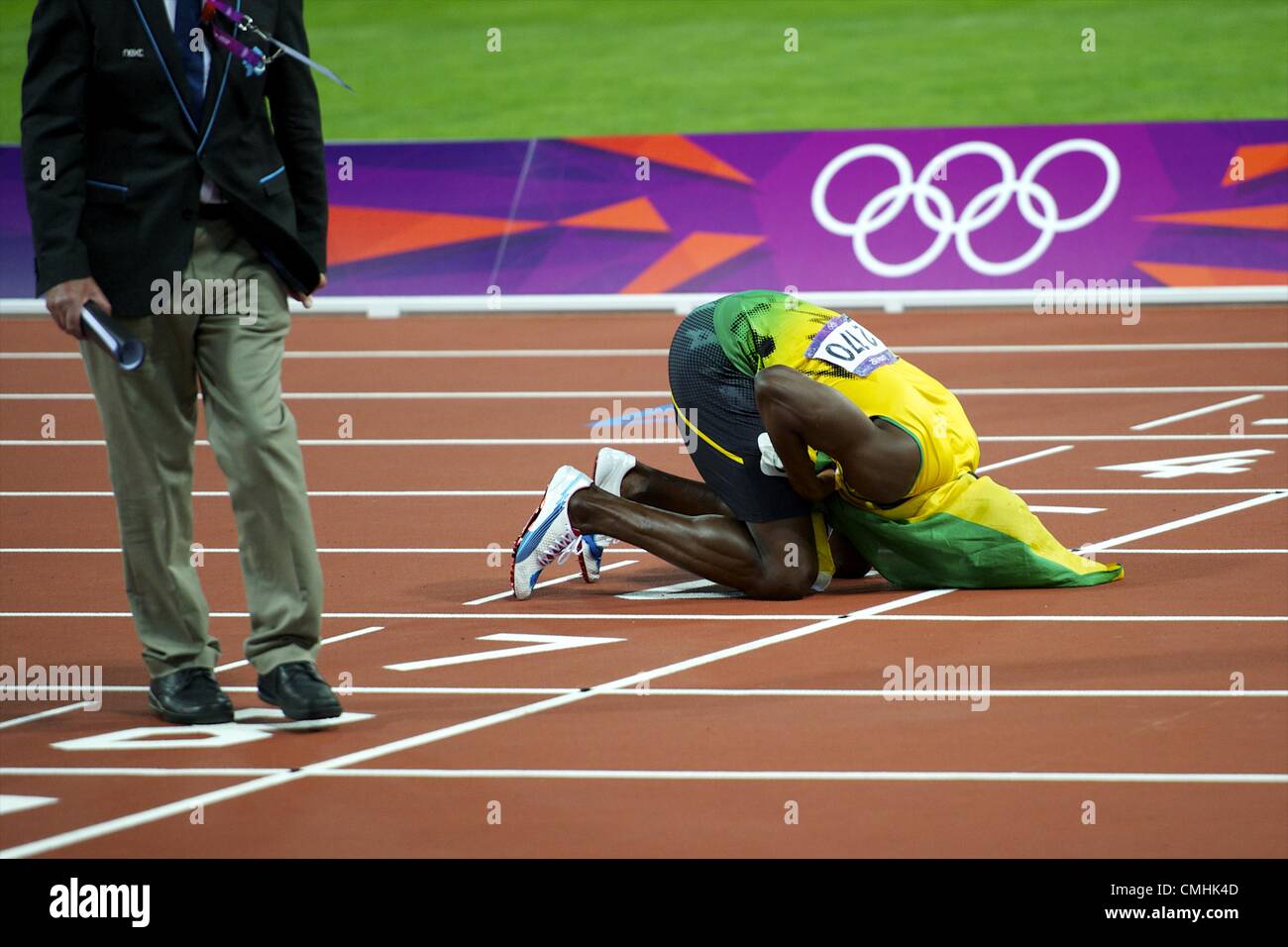 Aug. 11, 2012 - London, England, United Kingdom - USAIN BOLT kisses the finish line after the Jamaican 4x100m relay team won gold and set a new world record of 36.84 seconds during the 2012 London Summer Olympics. (Credit Image: © Mark Makela/ZUMAPRESS.com) Stock Photo