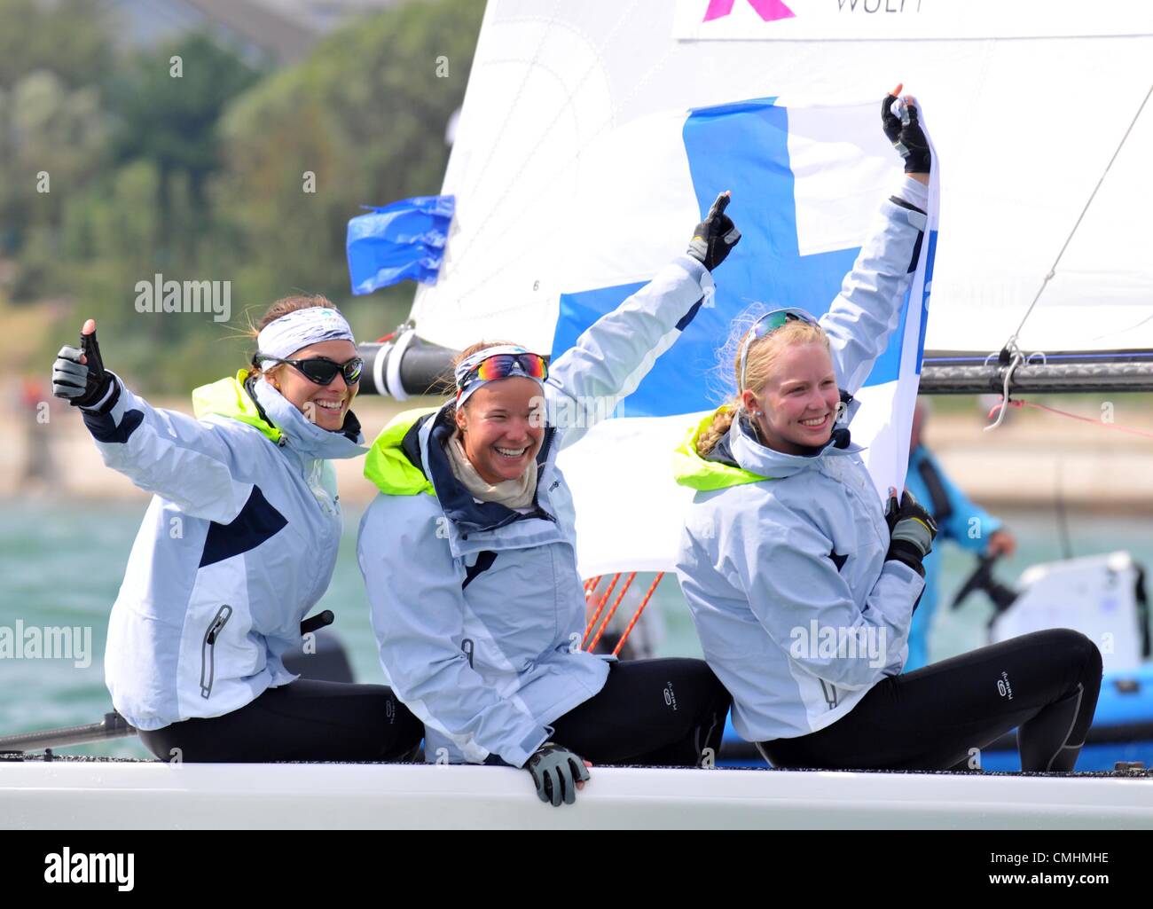 Mikaela Wulff, Silja Kanerva and Silja Lehtinen of Finland celebrate bronze in the women's Elliott 6m sailing class. London 2012 Olympics, Sailing at the Weymouth & Portland Venue, Dorset, Britain, UK.  August 11th, 2012 Stock Photo