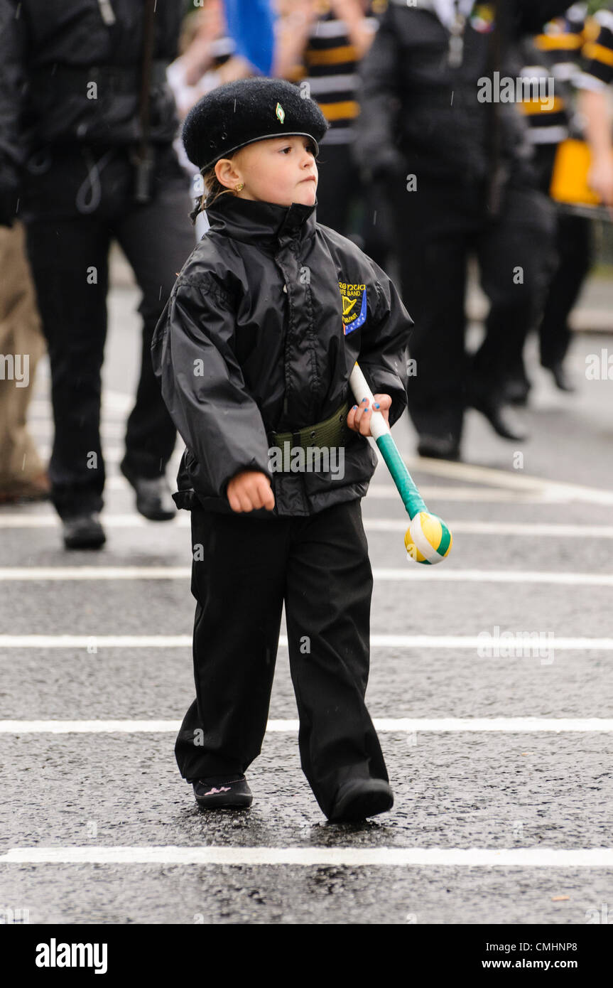 Young girl dressed in a pseudo paramilitary uniform marches at the head of an Irish republican flute band Stock Photo