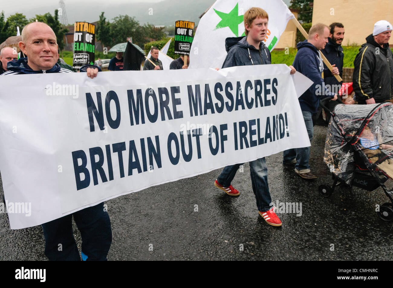 12th August 2012. Belfast.  Eirigi members carry a banner saying 'No more massacres. Britain out of Ireland!' Stock Photo
