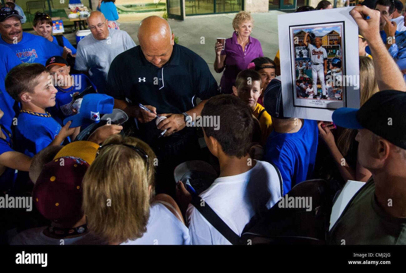Aug. 13, 2012 - Aberdeen, Maryland, U.S. - Cal Ripken Jr. signs autographs after the dedication of Ripken Way and Ernie Tyler Way at the Cal Ripken Academy in Aberdeen, Maryland on August 13, 2012.  The ceremony was attended by family members of longstanding clubhouse and umpire assistant Ernie Tyler and Cal Ripken Jr.. Tyler's son Fred Tyler threw the first pitch to Cal Ripken. (Credit Image: © Scott Serio/Eclipse/ZUMAPRESS.com) Stock Photo