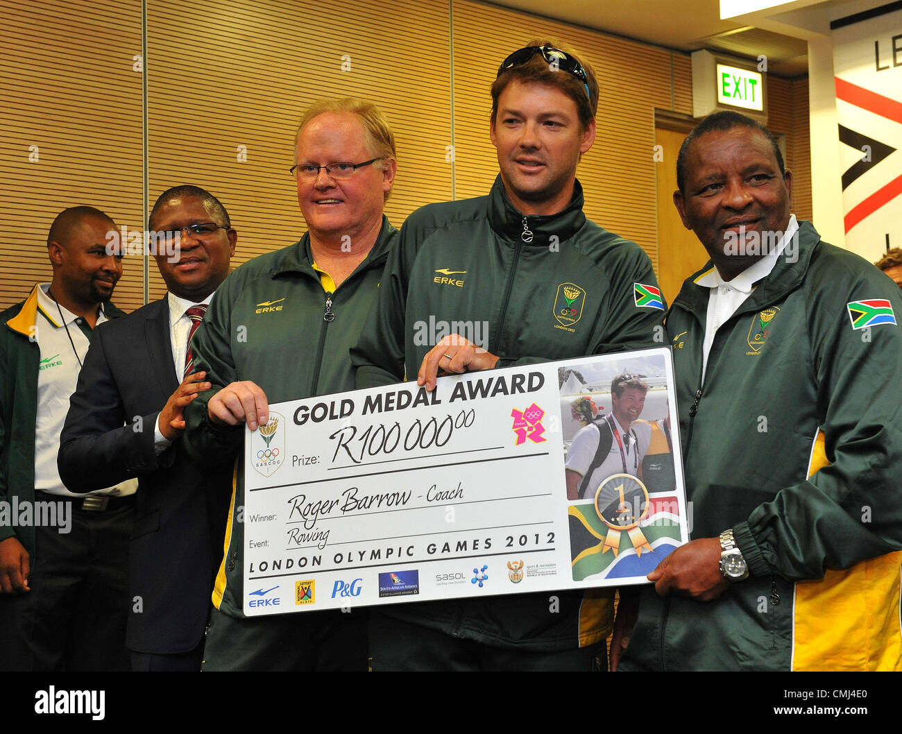 14th Aug 2012 Johannesburg, South Africa. Rowing coach Roger Barrow and assistant coach (Right) with Fikile Mdlalula and Gideon Sam during the South African Olympic team arrival and press conference at OR Tambo International Airport on August 14, 2012 in Johannesburg, South Africa Photo by Duif du Toit / Gallo Images Stock Photo