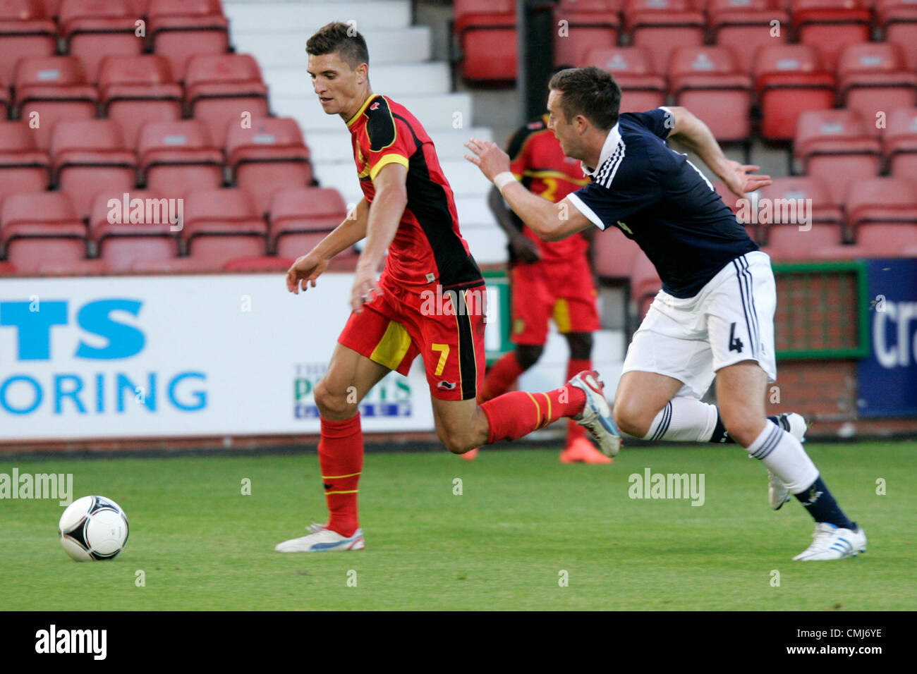 14th Aug 2012. 14.08.2012 Dunfermline, Scotland. 4 Daniel Wallace and 7 Thomas Meunier in action during the Vauxhall Under-21 International Challenge Match betweenScotland and Belgium at East End Park. Stock Photo