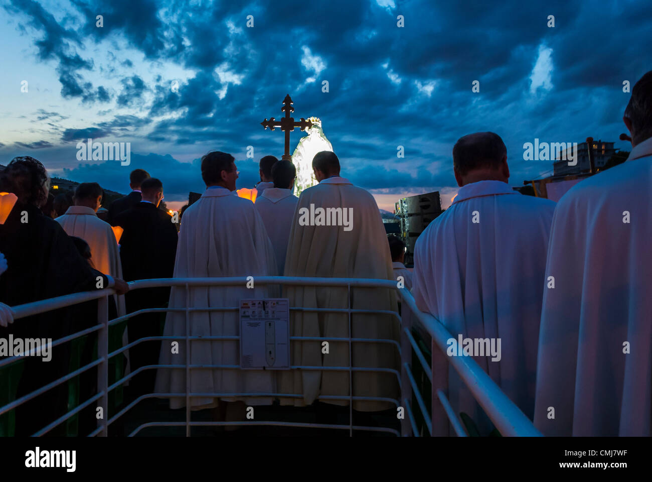 Paris, France, Christian Pilgrims Celebrating August 15, 'Assumption of the Virgin Mary', with Boat Ride, at Night, on the Seine River, france catholic church priests, Behind, european religious practice, virgin mary assumption Stock Photo