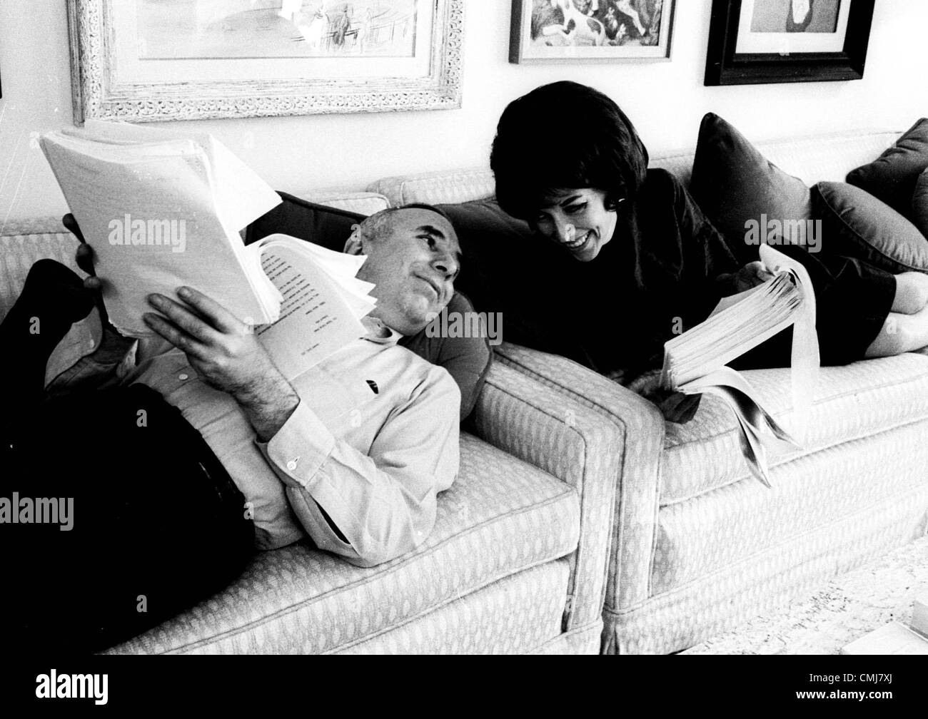 Jan. 1, 2011 - 20363.HELEN GURLEY BROWN AND DAVID BROWN.LYINNG ON TWIN COUCHES IN THEIR LIVING ROOM GOING OVER A MANUSCRIPT. JACK STAGER/   1965(Credit Image: © Globe Photos/ZUMAPRESS.com) Stock Photo