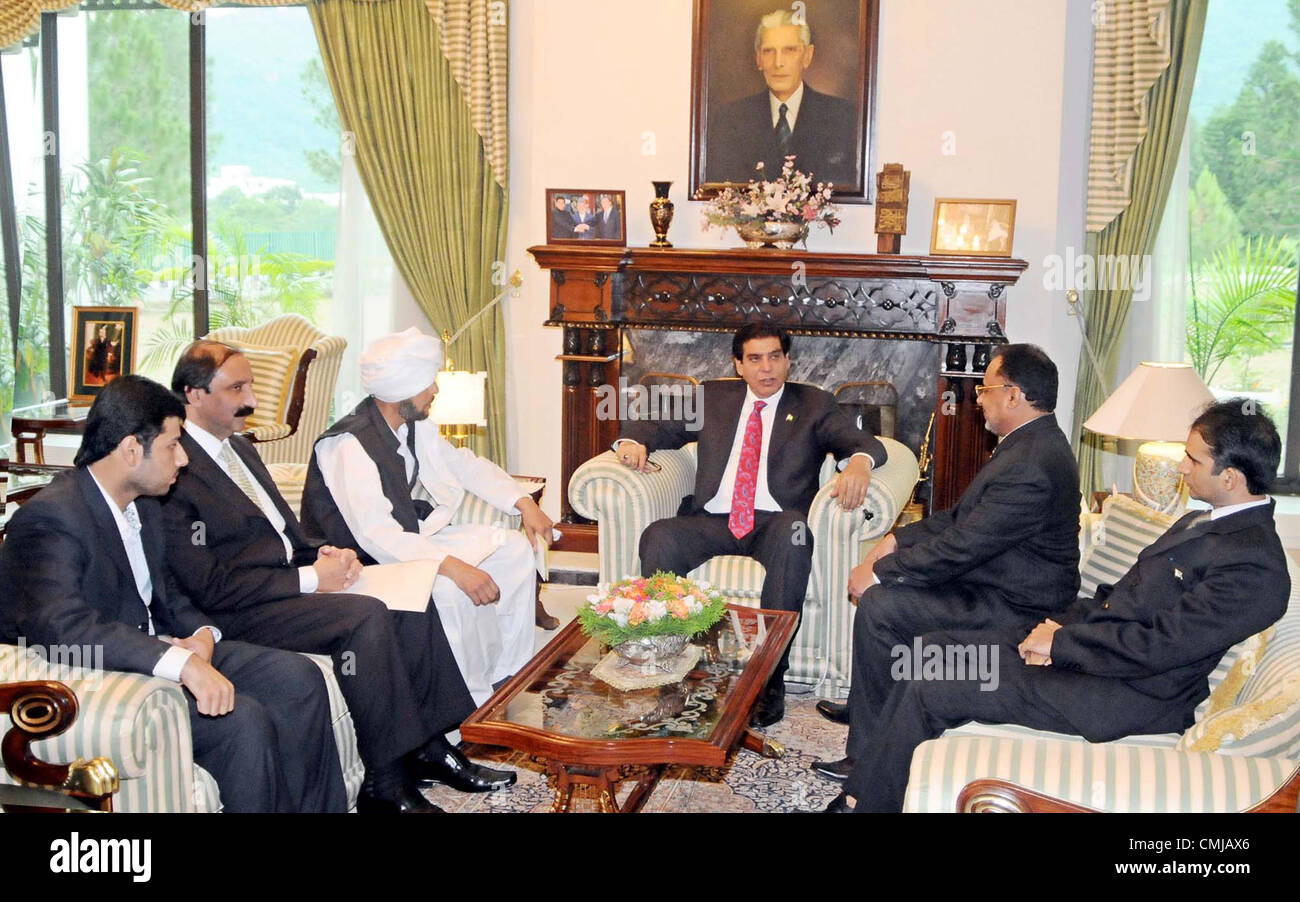 Prime Minister, Raja Pervez Ashraf talks with Professional and Technical  Training Minister, Sheikh Waqas Akram during meeting at PM House in  Islamabad on Monday, September 03, 2012 Stock Photo - Alamy