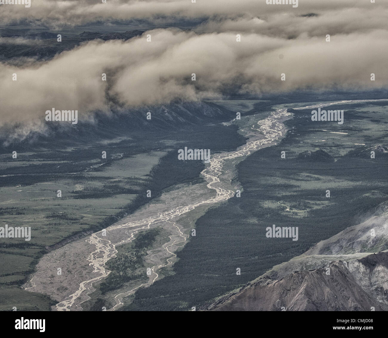 June 26, 2012 - Alaska, US - An aerial view of braided meltwater streams from massive glaciers in the 6 million acre (24,500Â km) wild Denali National Park and Preserve. Heavily loaded with rock debris, they continually shift and intertwine their channels over the valley floors and radically influence the topography. (Credit Image: © Arnold Drapkin/ZUMAPRESS.com) Stock Photo