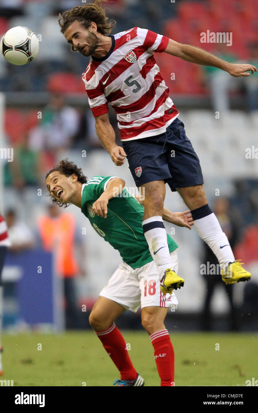 15th Aug 2012. 15.08.2012. Mexico City. Mexico.  Kyle Beckerman (USA) (5) heads the ball over Andres Guardado (MEX) (18). The United States Men's National Team defeated the Mexico Men's National Team 1-0 at Estadio Azteca in Mexico City, Mexico in an international friendly soccer match. © Action Plus Sports Images / Alamy Live News Stock Photo