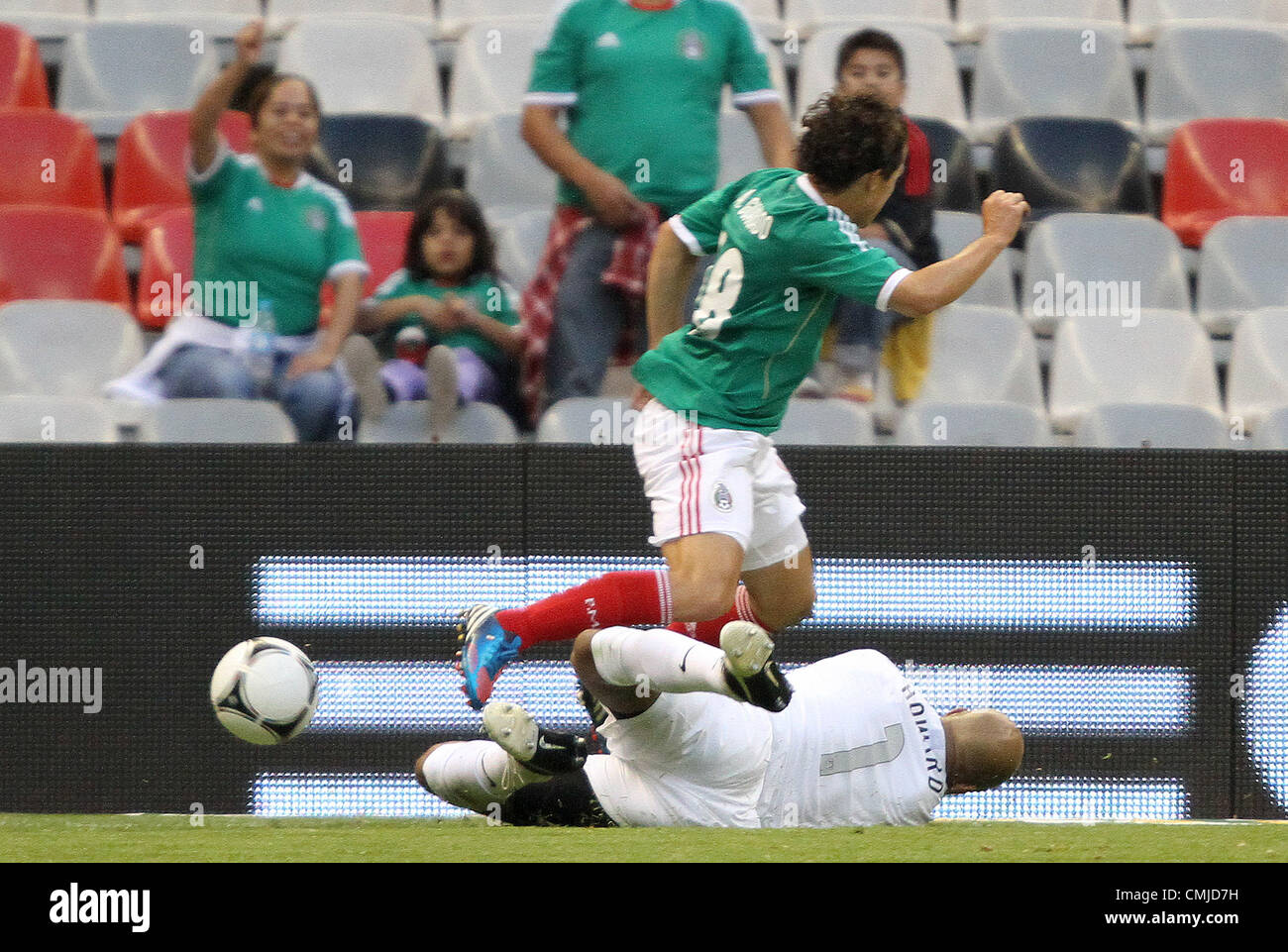 15th Aug 2012. 15.08.2012. Mexico City. Mexico.  Tim Howard (USA) (1) tackles the ball away from Andres Guardado (MEX) (18). The United States Men's National Team defeated the Mexico Men's National Team 1-0 at Estadio Azteca in Mexico City, Mexico in an international friendly soccer match. © Action Plus Sports Images / Alamy Live News Stock Photo