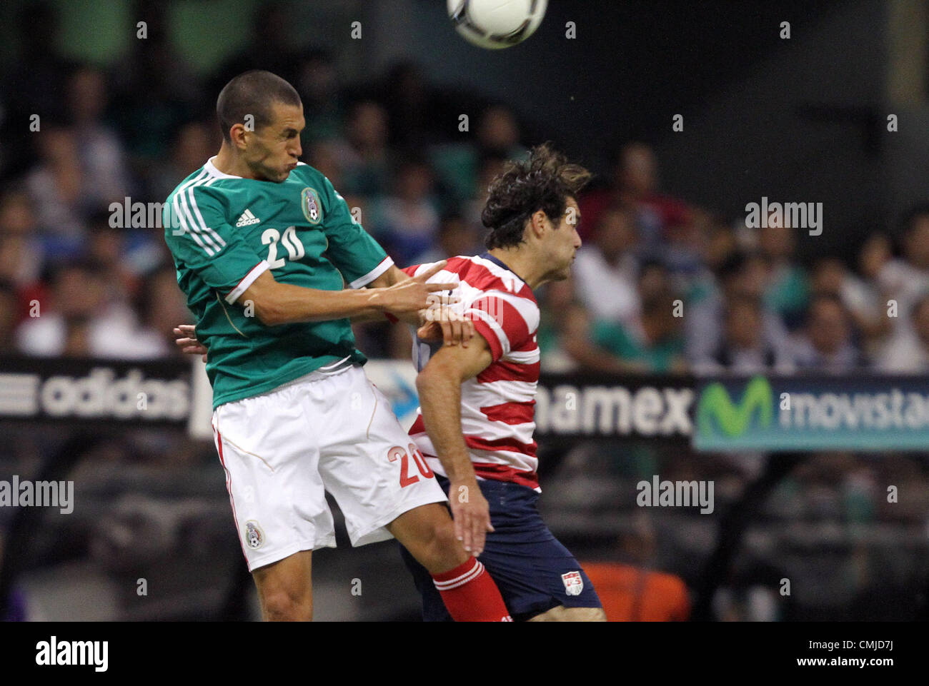 15th Aug 2012. 15.08.2012. Mexico City. Mexico.  Jorge Torres Nilo (MEX) (20) heads the ball over Graham Zusi (USA) (8). The United States Men's National Team defeated the Mexico Men's National Team 1-0 at Estadio Azteca in Mexico City, Mexico in an international friendly soccer match. © Action Plus Sports Images / Alamy Live News Stock Photo