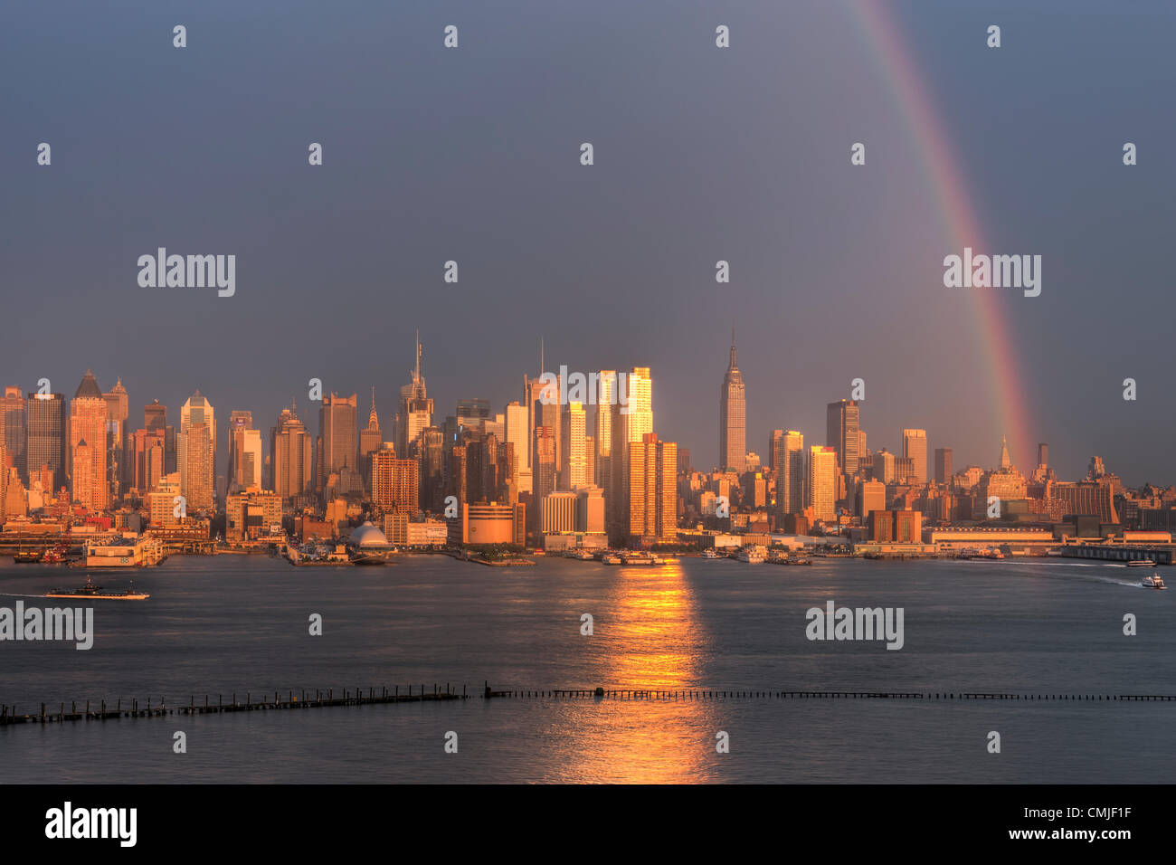 A rainbow appears over the midtown Manhattan skyline shortly after a ...