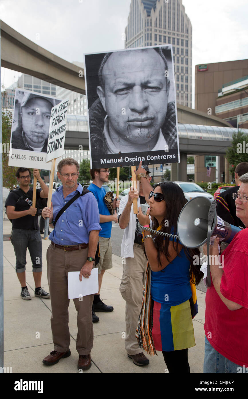 Detroit, Michigan - A picket at General Motors headquarters supports hunger strikers previously employed at GM's factory in Colombia. The hunger strikers say they were fired after suffering work-related injuries and that GM refuses to provide compensation or medical care. They are living in tents in front of the U.S. embassy in Bogotá; several have sewn their mouths shut. Stock Photo