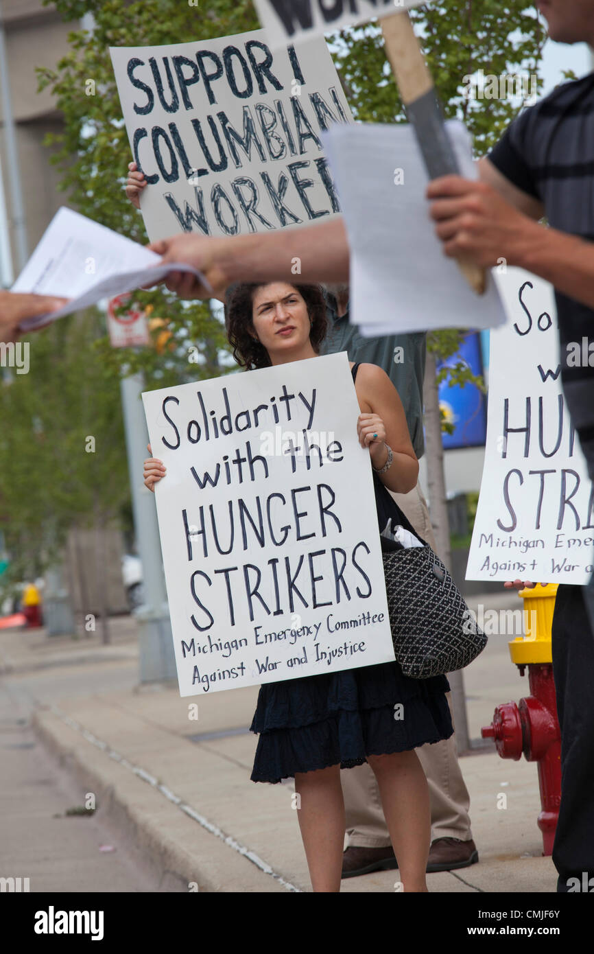 Detroit, Michigan - A picket at General Motors headquarters supports hunger strikers previously employed at GM's factory in Colombia. The hunger strikers say they were fired after suffering work-related injuries and that GM refuses to provide compensation or medical care. They are living in tents in front of the U.S. embassy in Bogotá; several have sewn their mouths shut. Stock Photo