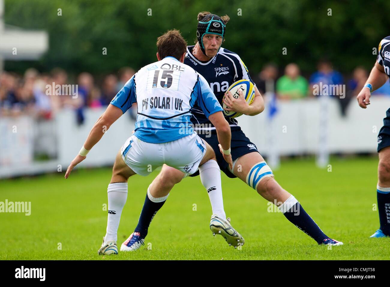 18.08.2012 Sale, England. Sale Sharks flanker James Gaskell (ENG) and Glasgow Warriors fullback Peter Murchie (SCO) in action during the Mark Cueto Testimonial match between Sale Sharks and Glasgow Warriors. Stock Photo