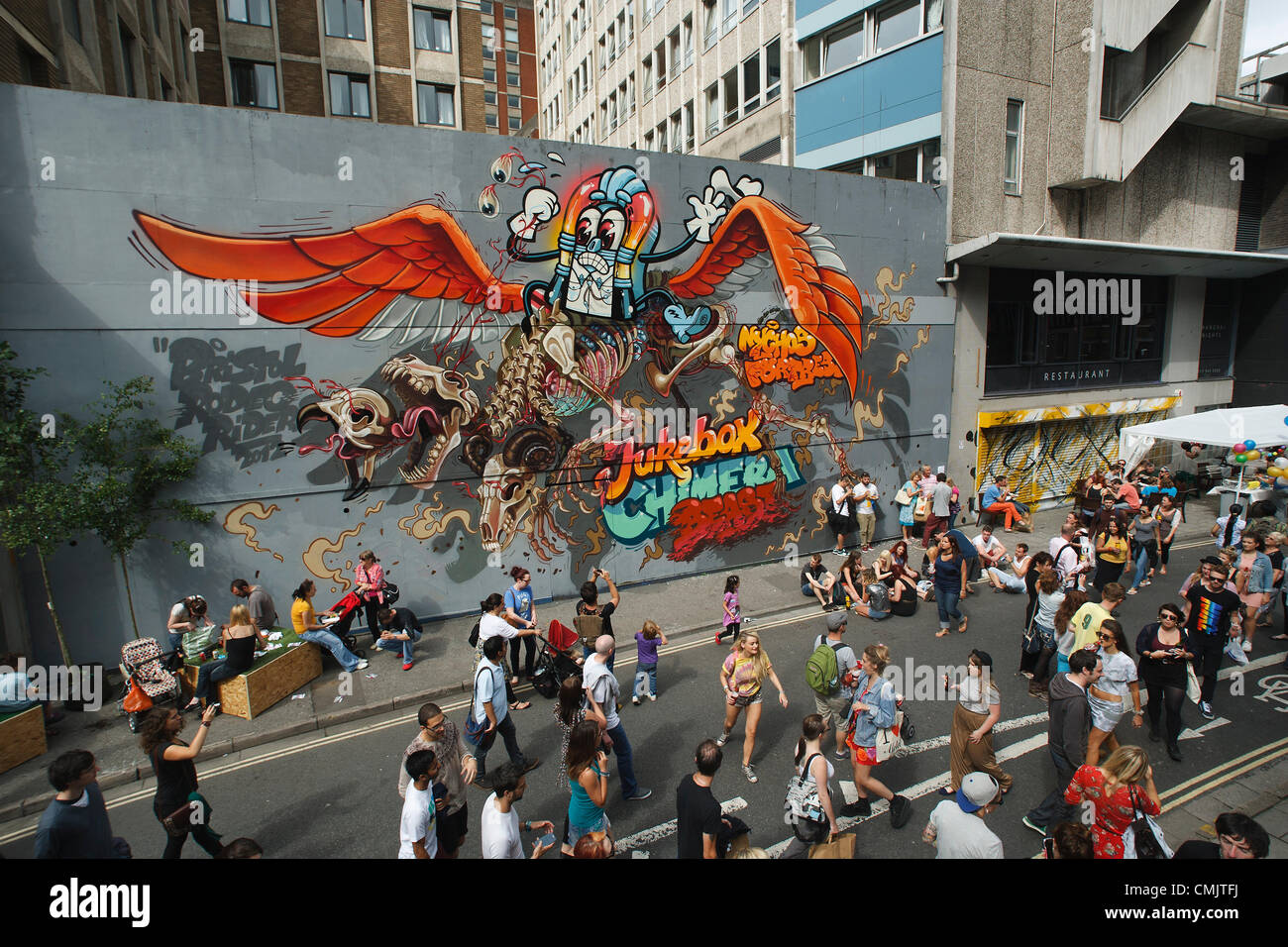 Bristol, UK. 18th August, 2012. Visitors to the See No Evil Street art