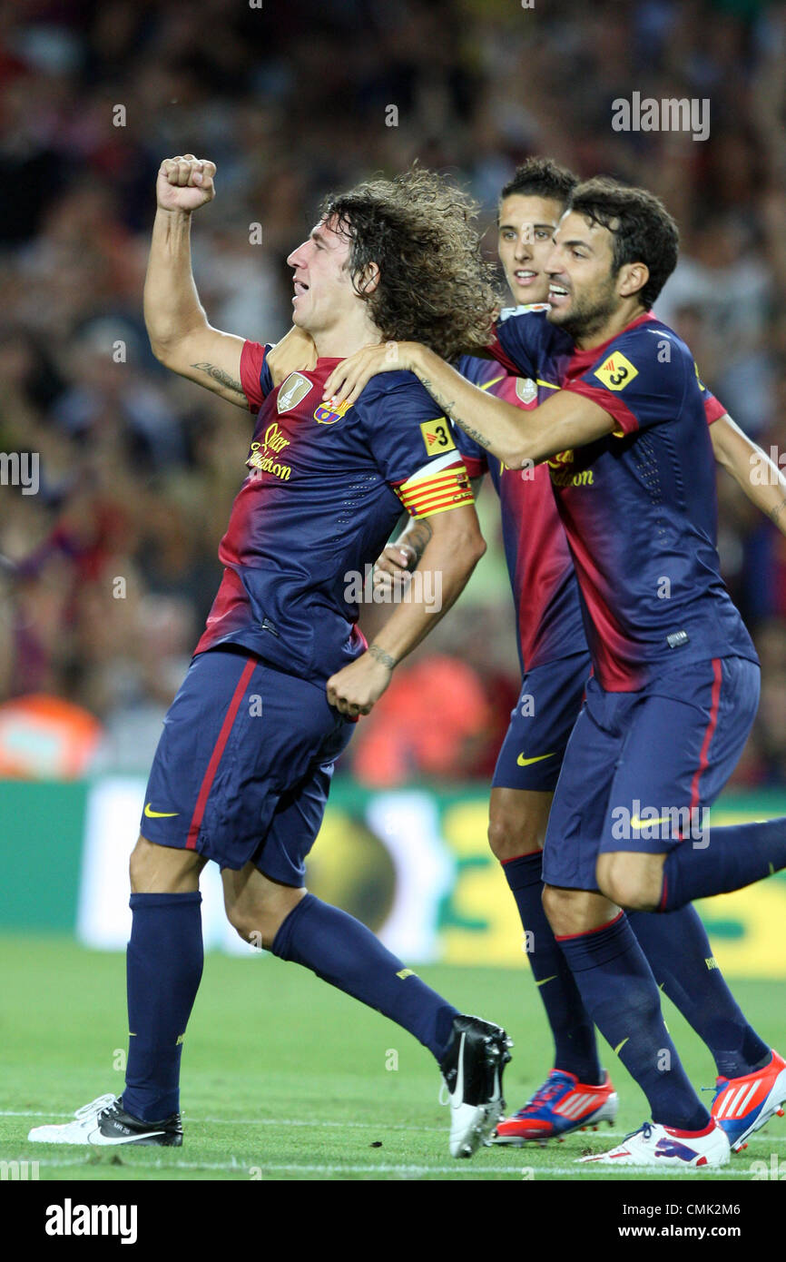 19.08.2012. Barcelona, Spain.  Barcelona's Carles Puyol celebrating his goal with Cesc Fabregas and Cristian Tello during First Division Spanish Liga soccer match - FC Barcelona v Real Sociedad at  Camp Nou  Stadium, Barcelona, Spain Stock Photo
