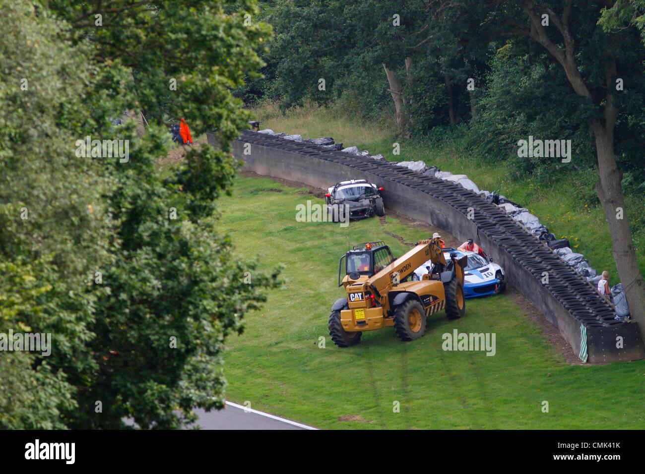 19.08.2012. Brands Hatch, Kent, England.  The cars of #10 Adrian Lester and an unknwon driver are recovered following an accident in the Lotus Cup UK Race at the Lotus Festival hosted by Brands Hatch in Kent Stock Photo