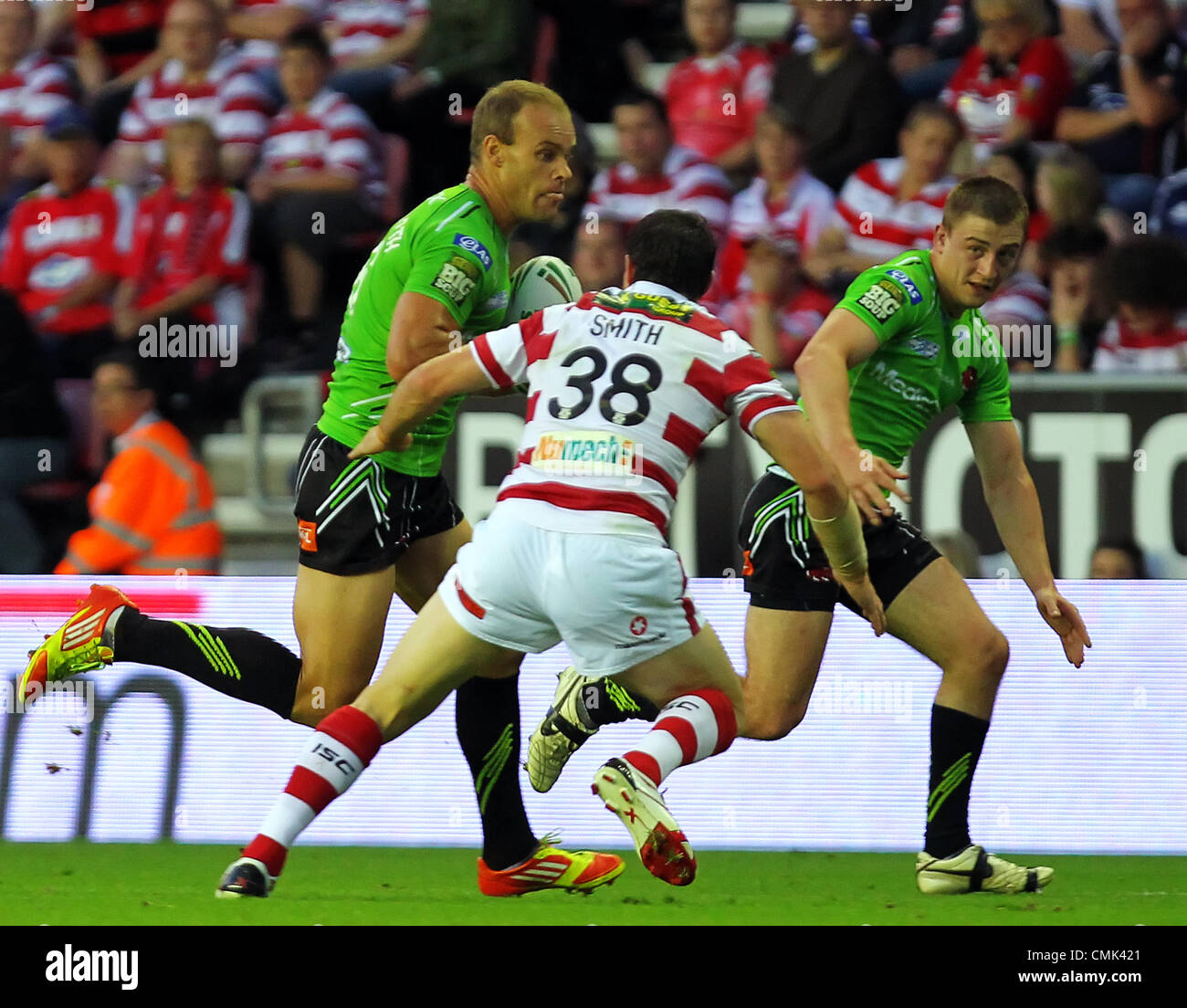20.08.2012 Wigan, England. Rugby League. Wigan Warriors v Salford City Reds. Salford City Reds Australian Stand Off Daniel Holdsworth and Wigan Warriors English Stand Off Matty Smith  in action during the Stobart Super League game played at the DW Stadium. Stock Photo
