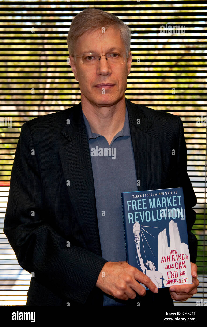 August 20, 2012 - Irvine, CA, USA -  Yaron Brook, Executive Director of The Ayn Rand Institute, holds an advance copy of his new book.  ARI, a 501(c)(3) nonprofit organization, is a think tank which works to introduce young people to Ayn Rand's novels, to support scholarship and research based on her ideas and to promote the principles of reason, rational self-interest, individual rights and laissez-faire capitalism to the widest possible audience. Stock Photo