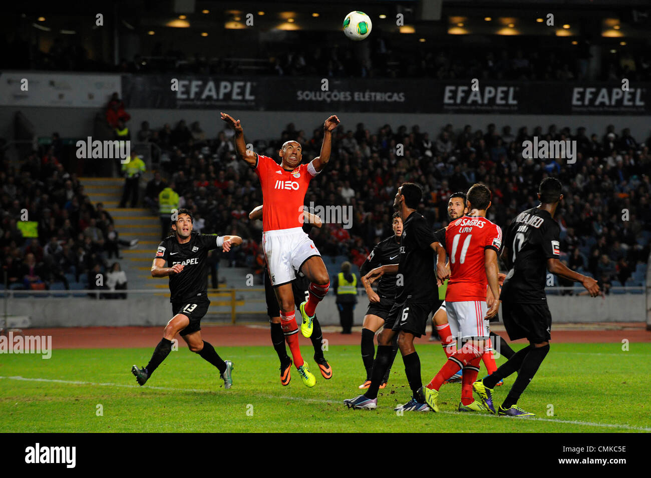 Brazilian defender Luisão of Benfica vies for the ball with Academica defenders during the portuguese Liga Sagres football match between Academica and Benfica Stock Photo