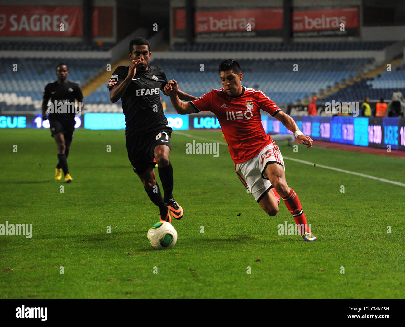 Benfica argentinian midfielder Enzo Perez vies for the ball with Academica defender Marcelo during the portuguese Liga Sagres football match between Academica and Benfica Stock Photo