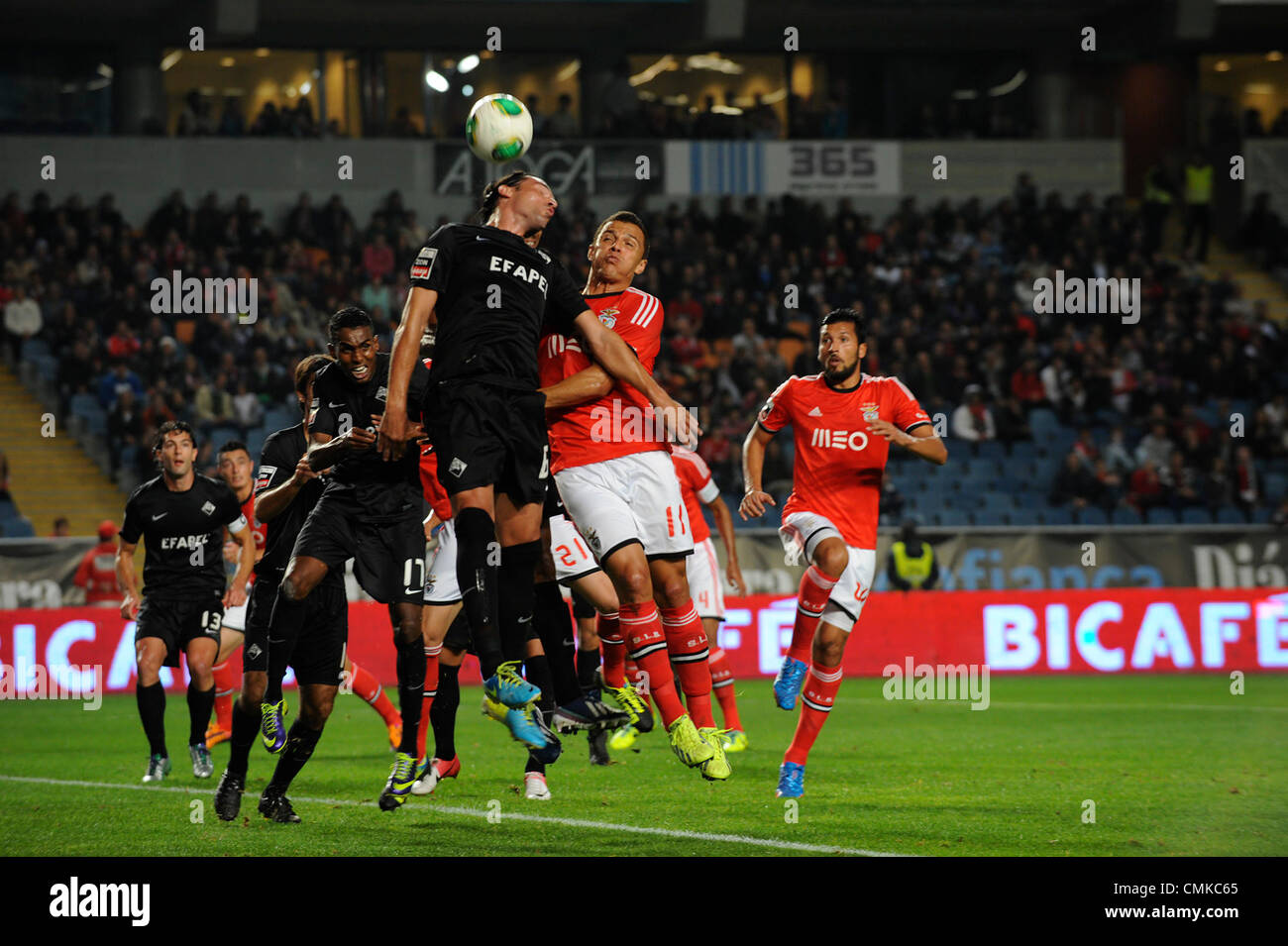 Academica defender Fernando vies for the ball with Benfica's striker Lima during the portuguese Liga Sagres football match between Academica and Benfica Stock Photo