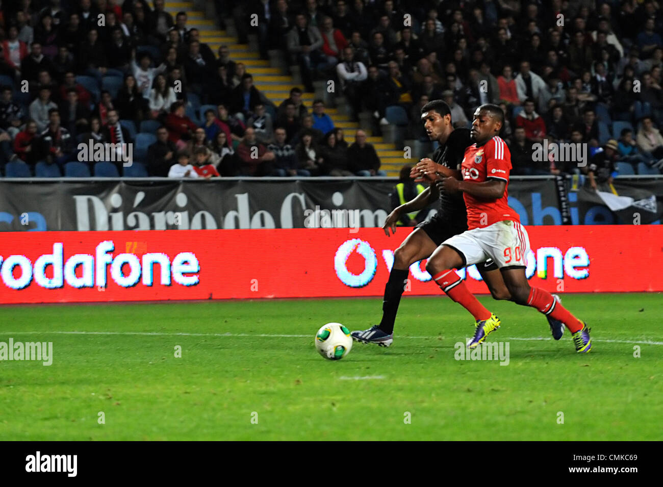 Benfica's Ivan Cavaleiro vies for the ball with an Academica defender during the portuguese Liga Sagres football match between Academica and Benfica Stock Photo
