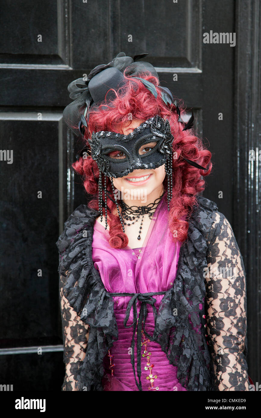 Woman. girl wearing purple goth costume with eye mask Whitby, Yorkshire