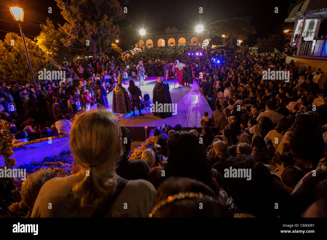 Hundreds of people gather to watch a play with costumed performers to celebrate the Day of the Dead Festival known in spanish as D’a de Muertos on November 1, 2013 in San Agustin Etlan, Oaxaca, Mexico. Stock Photo