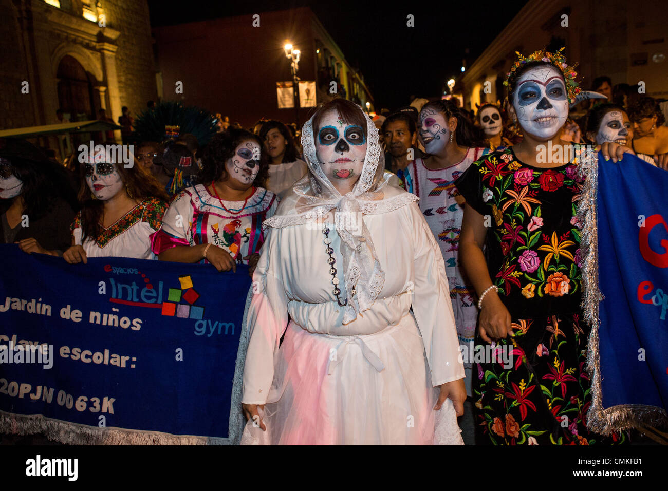 Revelers dressed in costume parade through the streets dressed in costumes during the Day of the Dead Festival known in spanish as D’a de Muertos on November 1, 2013 in Oaxaca, Mexico. Stock Photo