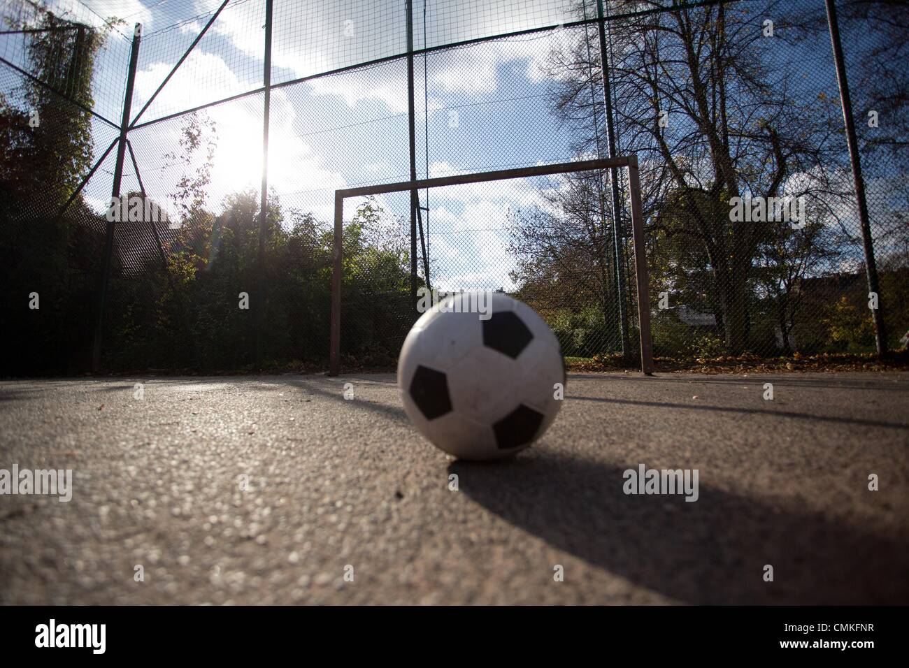 Berlin-Wedding, Germany. 30th Oct, 2013. A ball sits in a soccer cage on the Panke in Berlin-Wedding, Germany, 30 October 2013. Schalke's pro soccer player Kevin-Prince Boateng supposedly learned how to play soccer in this cage. Photo: Joerg Carstensen/dpa/Alamy Live News Stock Photo